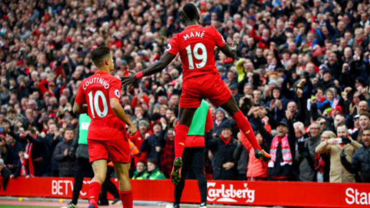 LIVERPOOL, ENGLAND – NOVEMBER 06: Sadio Mane of Liverpool celebrates scoring his sides first goal with Philippe Coutinho of Liverpool during the Premier League match between Liverpool and Watford at Anfield on November 6, 2016 in Liverpool, England. (Photo by Clive Brunskill/Getty Images)