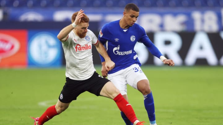 GELSENKIRCHEN, GERMANY - JANUARY 16: Mikkel Kirkeskov of Holstein Kiel battles for possession with Malick Thiaw of FC Schalke 04 during the Second Bundesliga match between FC Schalke 04 and Holstein Kiel at Veltins Arena on January 16, 2022 in Gelsenkirchen, Germany. (Photo by Lars Baron/Getty Images)