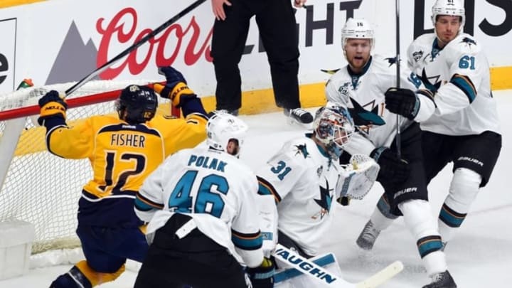May 3, 2016; Nashville, TN, USA; San Jose Sharks goalie Martin Jones (31) makes a save in traffic during the second period against the Nashville Predators in game three of the second round of the 2016 Stanley Cup Playoffs at Bridgestone Arena. Mandatory Credit: Christopher Hanewinckel-USA TODAY Sports