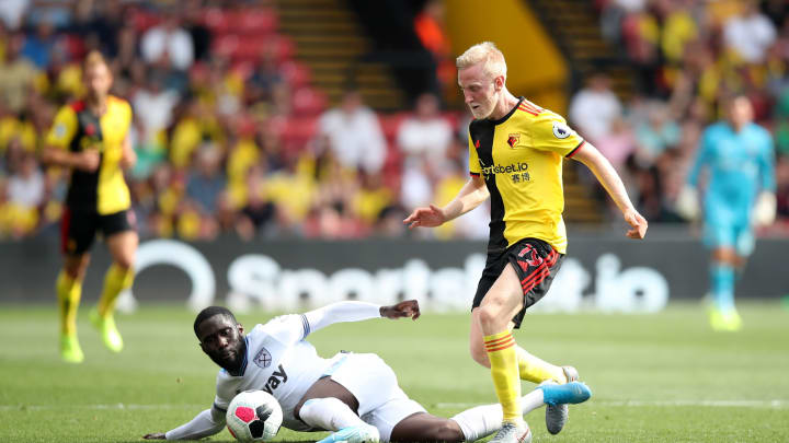 WATFORD, ENGLAND – AUGUST 24: Will Hughes of Watford wins the ball from Arthur Masuaku of West Ham United during the Premier League match between Watford FC and West Ham United at Vicarage Road on August 24, 2019 in Watford, United Kingdom. (Photo by Christopher Lee/Getty Images)