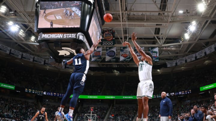 EAST LANSING, MI – DECEMBER 11: A.J. Hoggard #11 of the Michigan State Spartans shoots the ball over Jaheam Cornwall #11 of the Penn State Nittany Lions in the second half at Breslin Center on December 11, 2021, in East Lansing, Michigan. (Photo by Rey Del Rio/Getty Images)