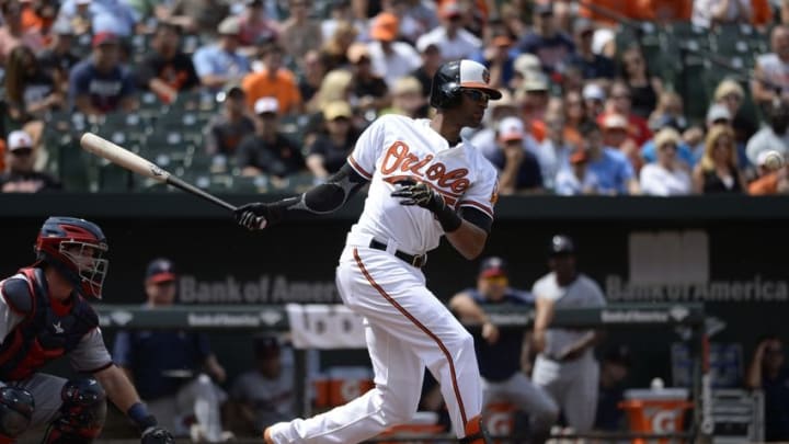 Aug 23, 2015; Baltimore, MD, USA; Baltimore Orioles left fielder Henry Urrutia (51) hits a infield single during the second inning against the Minnesota Twins at Oriole Park at Camden Yards. Mandatory Credit: Tommy Gilligan-USA TODAY Sports