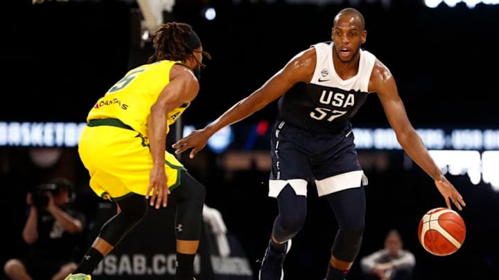 MELBOURNE, AUSTRALIA - AUGUST 24: Khris Middleton of the USA brings the ball up court defended by Patty Mills of Australia during game two of the International Basketball series between the Australian Boomers and United States of America at Marvel Stadium on August 24, 2019 in Melbourne, Australia. (Photo by Daniel Pockett/Getty Images)