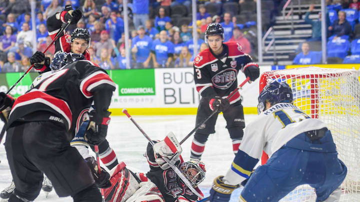 The Chicago Steel goalie falls while attempting to protect the goal during game one in the Clark Cup finals against the Sioux Falls Stampede on Friday, May 10, at the Sanford Premier Center in Sioux Falls.Stampede Game One 004