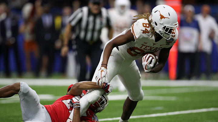 NEW ORLEANS, LOUISIANA – JANUARY 01: Lil’Jordan Humphrey #84 of the Texas Longhorns runs for a first down as he is tackled by Eric Stokes #27 of the Georgia Bulldogs at Mercedes-Benz Superdome on January 01, 2019 in New Orleans, Louisiana. (Photo by Chris Graythen/Getty Images)