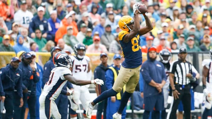 GREEN BAY, WISCONSIN - SEPTEMBER 22: Marquez Valdes-Scantling #83 of the Green Bay Packers makes a catch in front of DeVante Bausby #41 of the Denver Broncos during the second half at Lambeau Field on September 22, 2019 in Green Bay, Wisconsin. (Photo by Nuccio DiNuzzo/Getty Images)
