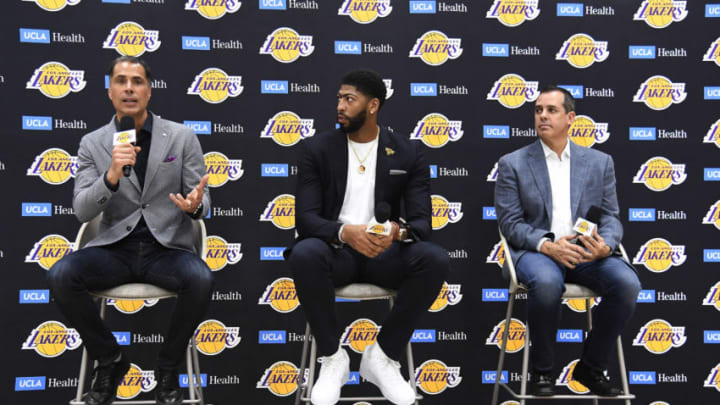 EL SEGUNDO, CA - JULY 13: General manager Rob Pelinka (L) speaks during news conference where he introduced the newest player of the Los Angeles Lakers Anthony Davis (C) with head coach Frank Vogel looking on at UCLA Health Training Center on July 13, 2019 in El Segundo, California. NOTE TO USER: User expressly acknowledges and agrees that, by downloading and/or using this Photograph, user is consenting to the terms and conditions of the Getty Images License Agreement. (Photo by Kevork Djansezian/Getty Images)