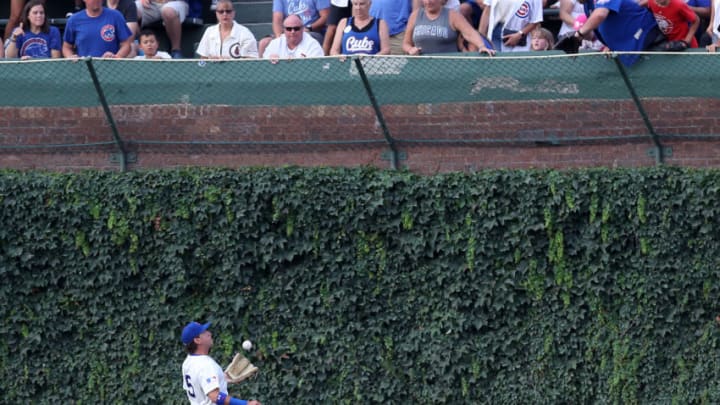 Chicago Cubs center fielder Albert Almora Jr. (5) makes a sliding catch at the wall in the first inning against the Cincinnati Reds on Tuesday, July 16, 2019 at Wrigley Field in Chicago, Ill. (Chris Sweda/Chicago Tribune/TNS via Getty Images)