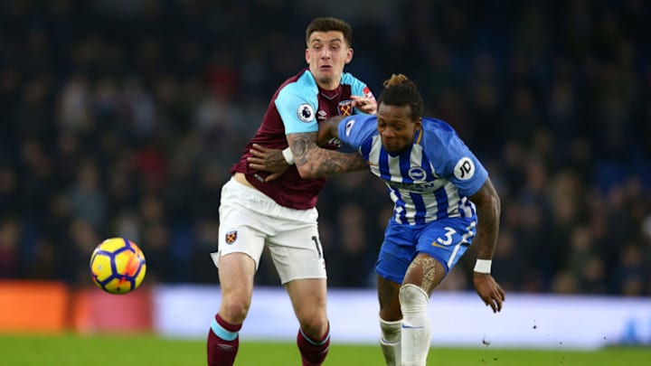 BRIGHTON, ENGLAND - FEBRUARY 03: Jordan Hugill of West Ham United and Gaetan Bong of Brighton and Hove Albion battle for the ball during the Premier League match between Brighton and Hove Albion and West Ham United at Amex Stadium on February 3, 2018 in Brighton, England. (Photo by Steve Bardens/Getty Images)