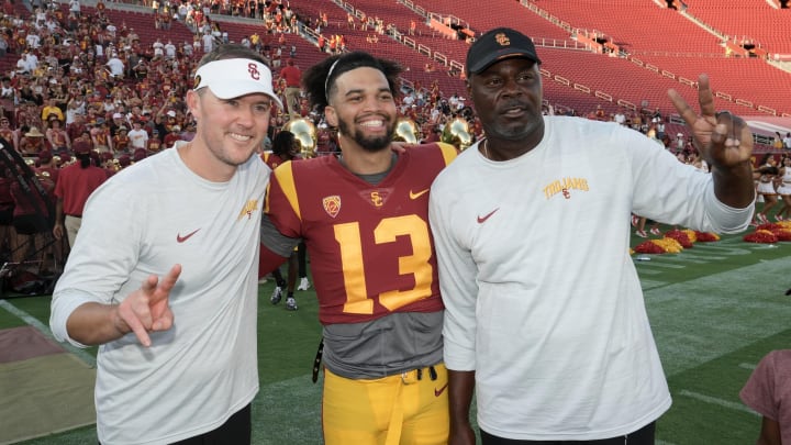 Sep 3, 2022; Los Angeles, California, USA; Southern California Trojans coach Lincoln Riley (left) and quarterback Caleb Williams (center) and outside wide receivers coach Dennis Simmons pose after a game against the Rice Owls at United Airlines Field at Los Angeles Memorial Coliseum. Mandatory Credit: Kirby Lee-USA TODAY Sports