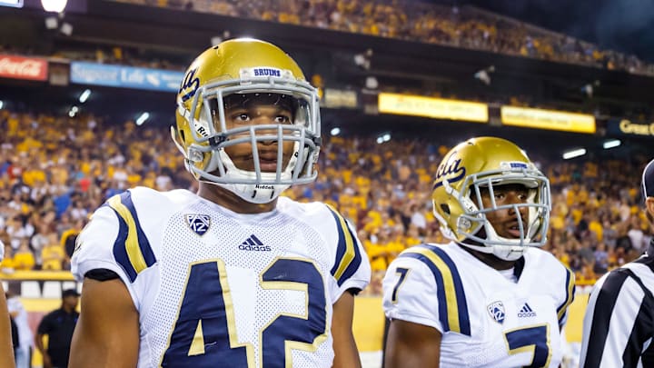 Oct 8, 2016; Tempe, AZ, USA; UCLA Bruins linebacker Kenny Young (42) and wide receiver Darren Andrews (7) against the Arizona State Sun Devils at Sun Devil Stadium. Mandatory Credit: Mark J. Rebilas-USA TODAY Sports