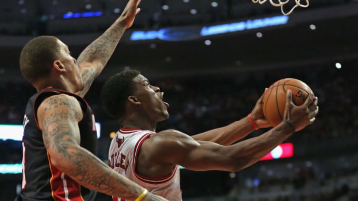 Jimmy Butler #21 of the Chicago Bulls puts up a reverse layup against Michael Beasley #8 of the Miami Heat (Photo by Jonathan Daniel/Getty Images)