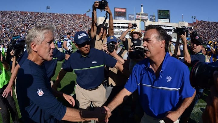 Sep 18, 2016; Los Angeles, CA, USA; Seattle Seahawks coach Pete Carroll (left) and Los Angeles Rams coach Jeff Fisher shake hands after a NFL game at Los Angeles Memorial Coliseum. The Rams defeated the Seahawks 9-3. Mandatory Credit: Kirby Lee-USA TODAY Sports