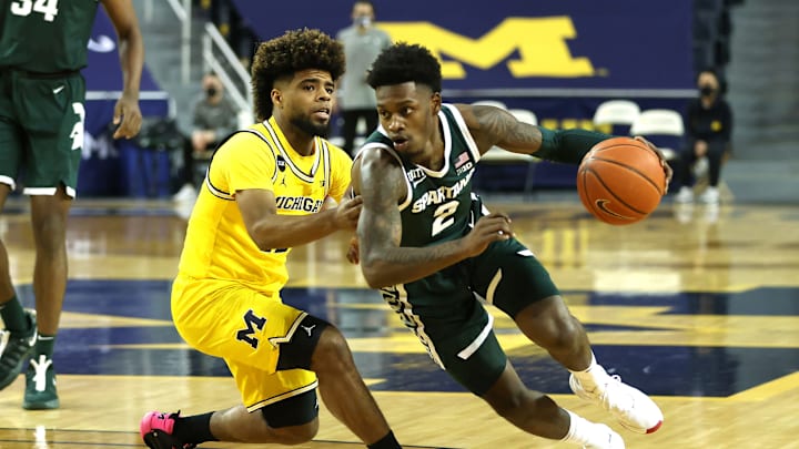 ANN ARBOR, MICHIGAN – MARCH 04: Rocket Watts #2 of the Michigan State Spartans drives around Mike Smith #12 of the Michigan Wolverines during the first half at Crisler Arena on March 04, 2021 in Ann Arbor, Michigan. (Photo by Gregory Shamus/Getty Images)