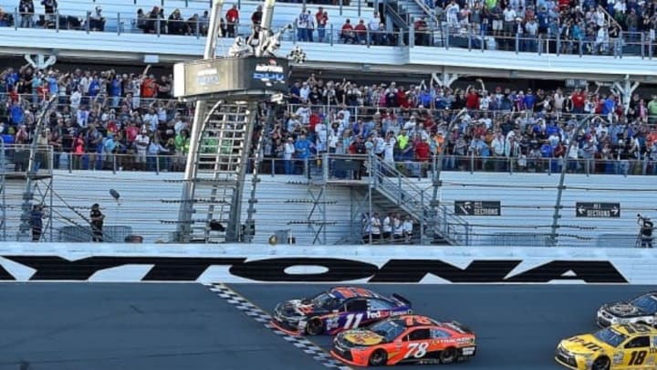 Feb 21, 2016; Daytona Beach, FL, USA; NASCAR Sprint Cup Series driver Denny Hamlin (11) beats NASCAR Sprint Cup Series driver Martin Truex Jr. (78) to win the Daytona 500 at Daytona International Speedway. Mandatory Credit: Jasen Vinlove-USA TODAY Sports