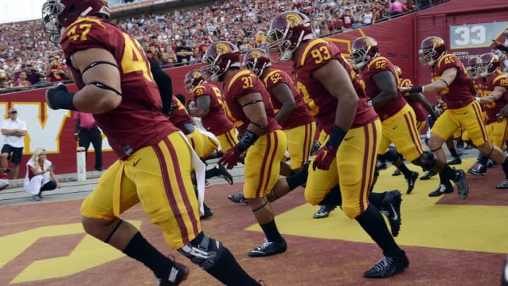 Oct 24, 2015; Los Angeles, CA, USA; The Southern California Trojans run out onto the field prior to the game against the Utah Utes at Los Angeles Memorial Coliseum. Mandatory Credit: Kelvin Kuo-USA TODAY Sports