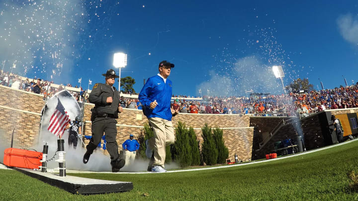 DURHAM, NC – NOVEMBER 05: Head coach David Cutcliffe of the Duke Blue Devils leads his team onto the field prior to their game against the Virginia Tech Hokies at Wallace Wade Stadium on November 5, 2016 in Durham, North Carolina. Virginia Tech defeated Duke 24-21. (Photo by Lance King/Getty Images)