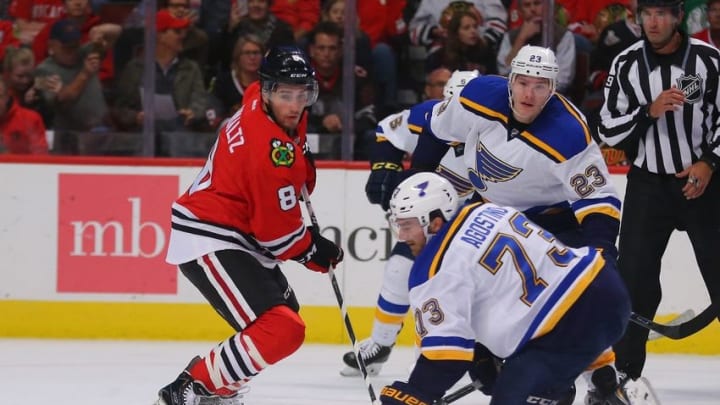 Oct 1, 2016; Chicago, IL, USA; Chicago Blackhawks center Nick Schmaltz (8) and St. Louis Blues left wing Kenny Agostino (73) follow the puck during the first period of a preseason hockey game at the United Center. Mandatory Credit: Dennis Wierzbicki-USA TODAY Sports