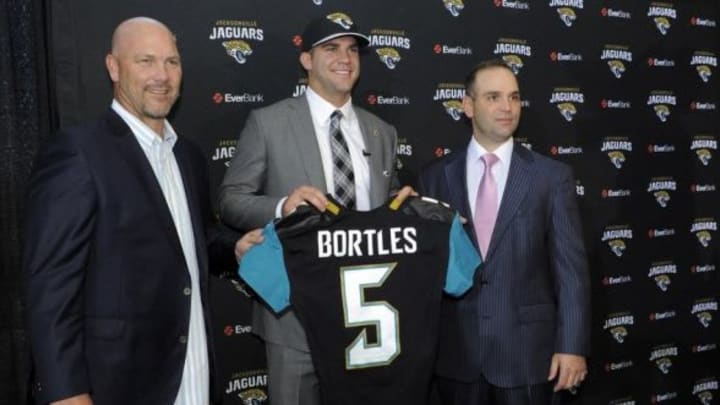 May 9, 2014; Jacksonville, FL, USA; Jacksonville Jaguars head coach Gus Bradley poses with Blake Bortles (Central Florida) and Jaguars general manager David Caldwell after addressing the media at the Upper West Touchdown Club at EverBank Field a day after being selected as the third overall pick in the first round of the 2014 NFL draft by the Jacksonville Jaguars. Mandatory Credit: John David Mercer-USA TODAY Sports