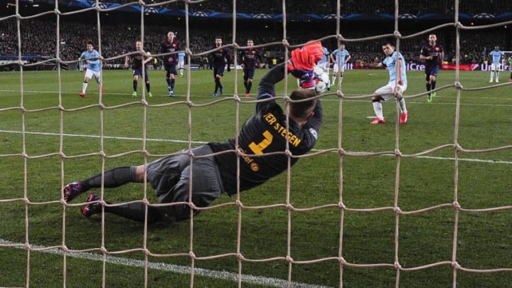 Barcelona's German goalkeeper Marc-Andre ter Stegen blocks a penalty kick off Manchester City's Argentinian forward Sergio Aguero during the UEFA Champions League round of 16 football match FC Barcelona vs Manchester City at the Camp Nou stadium in Barcelona on March 18, 2015. AFP PHOTO/ JOSEP LAGO (Photo credit should read JOSEP LAGO/AFP/Getty Images)