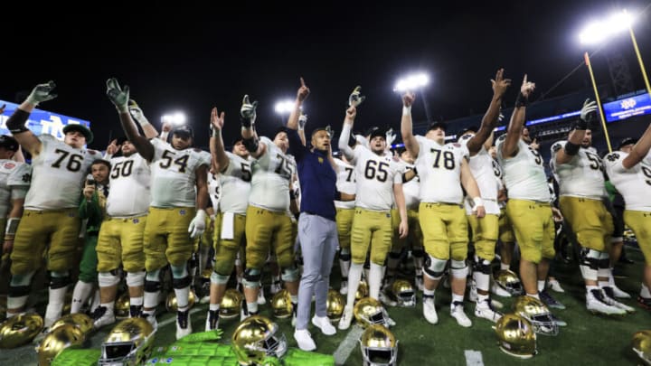 JACKSONVILLE, FLORIDA - DECEMBER 30: head coach Marcus Freeman of the Notre Dame Fighting Irish celebrates with his team after defeating the South Carolina Gamecocks 45-38 in the TaxSlayer Gator Bowl at TIAA Bank Field on December 30, 2022 in Jacksonville, Florida. (Photo by James Gilbert/Getty Images)