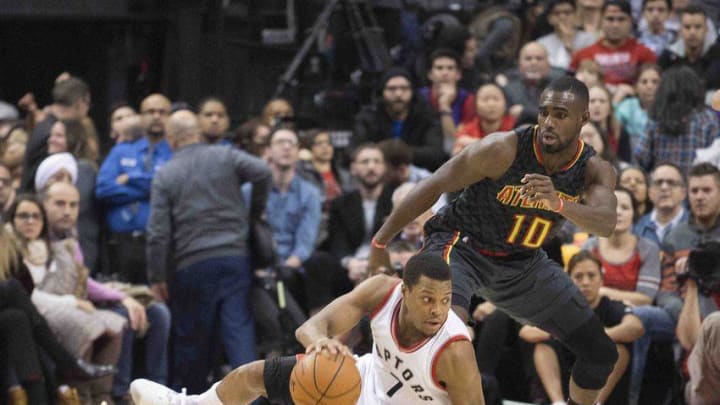 Dec 16, 2016; Toronto, Ontario, CAN; Toronto Raptors guard Kyle Lowry (7) battles for a ball with Atlanta Hawks guard Tim Hardaway Jr. (10) during the fourth quarter in a game at Air Canada Centre. The Atlanta Hawks won 125-121. Mandatory Credit: Nick Turchiaro-USA TODAY Sports