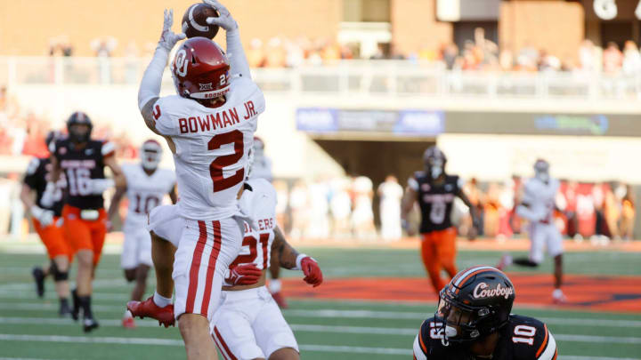 Oklahoma Sooners defensive back Billy Bowman Jr. (2) intercepts a pass beside Oklahoma State Cowboys wide receiver Rashod Owens (10) during a Bedlam college football game between the Oklahoma State University Cowboys (OSU) and the University of Oklahoma Sooners (OU) at Boone Pickens Stadium in Stillwater, Okla., Saturday, Nov. 4, 2023. Oklahoma State won 27-24.