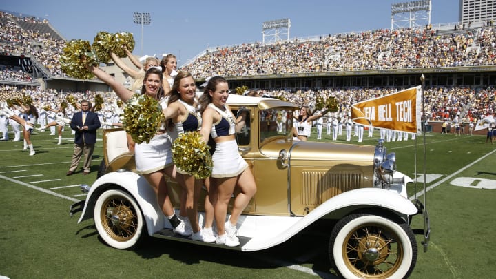 Georgia Tech Yellow Jackets cheerleaders ride out on the Rambling Wreck restored 1930 Model A Ford Sport Coupe car before the game against the Miami Hurricanes at Bobby Dodd Stadium on September 22, 2012 in Atlanta, Georgia. Miami won 42-36 in overtime. (Photo by Joe Robbins/Getty Images)