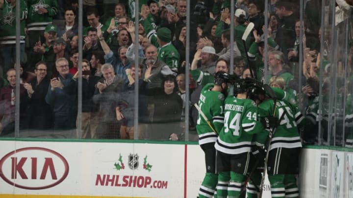 DALLAS, TX - DECEMBER 18: Martin Hanzal #11, Gavin Bayreuther #44, Roman Polak #45 ad the Dallas Stars celebrate a goal against the Calgary Flames at the American Airlines Center on December 18, 2018 in Dallas, Texas. (Photo by Glenn James/NHLI via Getty Images)