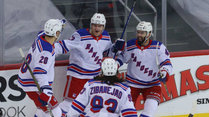 Mar 6, 2021; Newark, New Jersey, USA; New York Rangers players celebrate a goal by defenseman Adam Fox (23) during the first period against the New Jersey Devils at Prudential Center. Mandatory Credit: Ed Mulholland-USA TODAY Sports