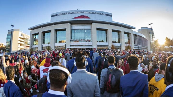 FAYETTEVILLE, AR - NOVEMBER 10: Players of the Arkansas Razorbacks greets fans during the walk into the stadium before a game against the LSU Tigers at Razorback Stadium on November 10, 2018 in Fayetteville, Arkansas. (Photo by Wesley Hitt/Getty Images)