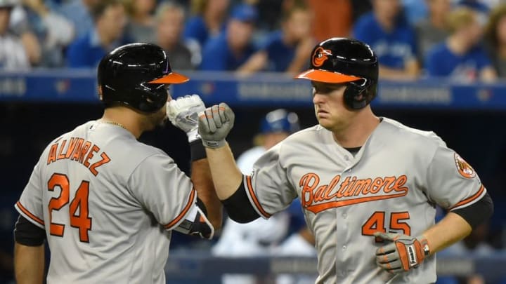 Sep 28, 2016; Toronto, Ontario, CAN; Baltimore Orioles right fielder Mark Trumbo (45) is greeted by pinch hitter Pedro Alvarez (24) after hitting a solo home run against Toronto Blue Jays in the eighth inning at Rogers Centre. Mandatory Credit: Dan Hamilton-USA TODAY Sports Sep 28, 2016; Toronto, Ontario, CAN; Baltimore Orioles right fielder Mark Trumbo (45) is greeted by pinch hitter Pedro Alvarez (24) after hitting a solo home run against Toronto Blue Jays in the eighth inning at Rogers Centre. Mandatory Credit: Dan Hamilton-USA TODAY Sports