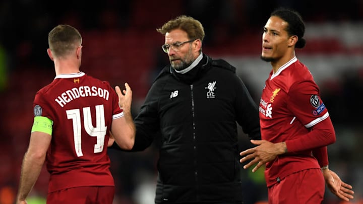 LIVERPOOL, ENGLAND - APRIL 04: Jordan Henderson of Liverpool and Jurgen Klopp, Manager of Liverpool celebrate victory after the UEFA Champions League Quarter Final Leg One match between Liverpool and Manchester City at Anfield on April 4, 2018 in Liverpool, England. (Photo by Shaun Botterill/Getty Images)