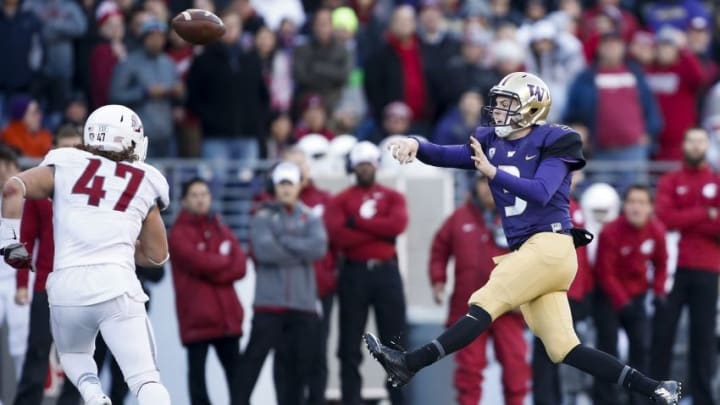 Nov 27, 2015; Seattle, WA, USA; Washington Huskies quarterback Jake Browning (3) throws the ball past Washington State Cougars linebacker Peyton Pelluer (47) during the third quarter at Husky Stadium. The Huskies won 45-10. Mandatory Credit: Jennifer Buchanan-USA TODAY Sports