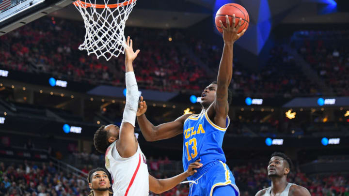 LAS VEGAS, NV - MARCH 9: UCLA guard Kris Wilkes (13) shoots over Arizona guard Parker Jackson-Cartwright (0) during the semifinal game of the mens Pac-12 Tournament between the UCLA Bruins and the Arizona Wildcats on March 9, 2018, at the T-Mobile Arena in Las Vegas, NV. (Photo by Brian Rothmuller/Icon Sportswire via Getty Images)