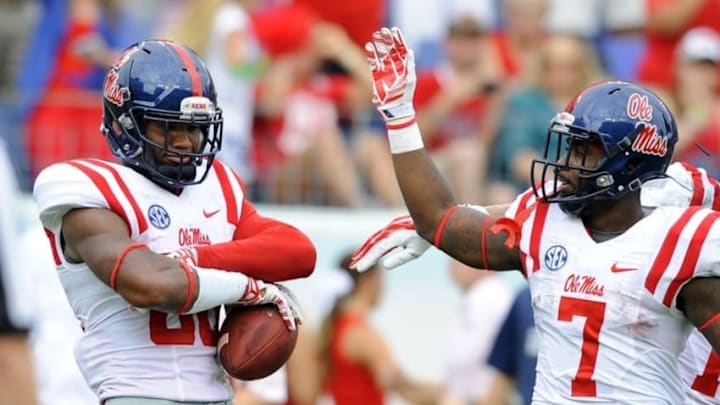 Sep 6, 2014; Nashville, TN, USA; Mississippi Rebels receiver Cody Core (88) celebrates with running back Mark Dodson (7) after scoring during the first half against the Vanderbilt Commodores at LP Field. Mandatory Credit: Christopher Hanewinckel-USA TODAY Sports
