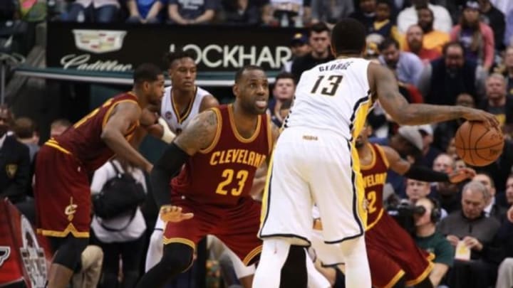 Feb 1, 2016; Indianapolis, IN, USA; Cleveland Cavaliers forward LeBron James (23) guards Indiana Pacers forward Paul George (13) at Bankers Life Fieldhouse. The Cavaliers won 111-106 in overtime. Mandatory Credit: Brian Spurlock-USA TODAY Sports