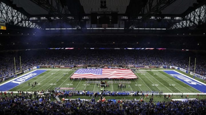 Nov 24, 2016; Detroit, MI, USA; Patrons display the American flag on the field during the national anthem performed by Aretha Franklin before the game between the Detroit Lions and the Minnesota Vikings at Ford Field. Mandatory Credit: Raj Mehta-USA TODAY Sports