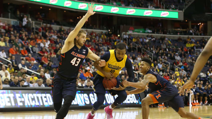 Mar 9, 2017; Washington, DC, USA; Michigan Wolverines guard Muhammad-Ali Abdur-Rahkman (12) attempts to control the ball between Illinois Fighting Illini forward Michael Finke (43) and Illini guard Te’Jon Lucas (3) in the second half during the Big Ten Conference Tournament at Verizon Center. The Wolverines won 75-55. Mandatory Credit: Geoff Burke-USA TODAY Sports
