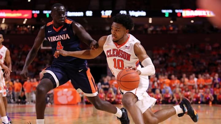 Mar 1, 2016; Greenville, SC, USA; Clemson Tigers guard Gabe DeVoe (10) drives to the basket as Virginia Cavaliers guard Marial Shayok (4) defends during the second half at Bon Secours Wellness Arena. The Cavaliers won 64-57. Mandatory Credit: Dawson Powers-USA TODAY Sports