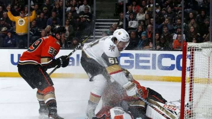 ANAHEIM, CA - DECEMBER 27: John Gibson #36 of the Anaheim Ducks makes a save against Mark Stone #61 of the Vegas Golden Knights with help from Sam Carrick #39 during the game at Honda Center on December 27, 2019 in Anaheim, California. (Photo by Debora Robinson/NHLI via Getty Images)