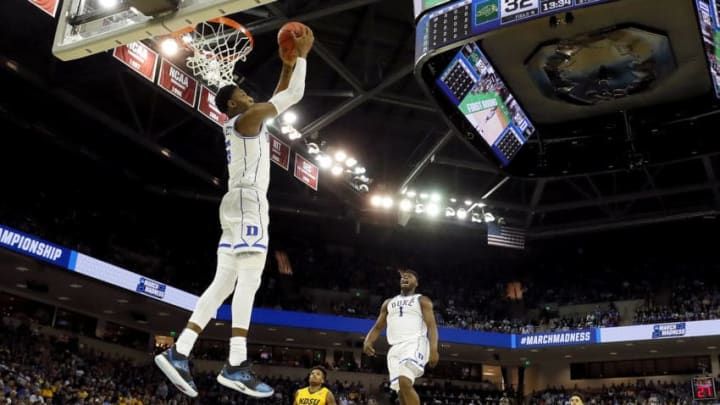 COLUMBIA, SOUTH CAROLINA - MARCH 22: RJ Barrett #5 of the Duke Blue Devils dunks the ball as teammate Zion Williamson #1 celebrates against the North Dakota State Bison in the second half during the first round of the 2019 NCAA Men's Basketball Tournament at Colonial Life Arena on March 22, 2019 in Columbia, South Carolina. (Photo by Kevin C. Cox/Getty Images)