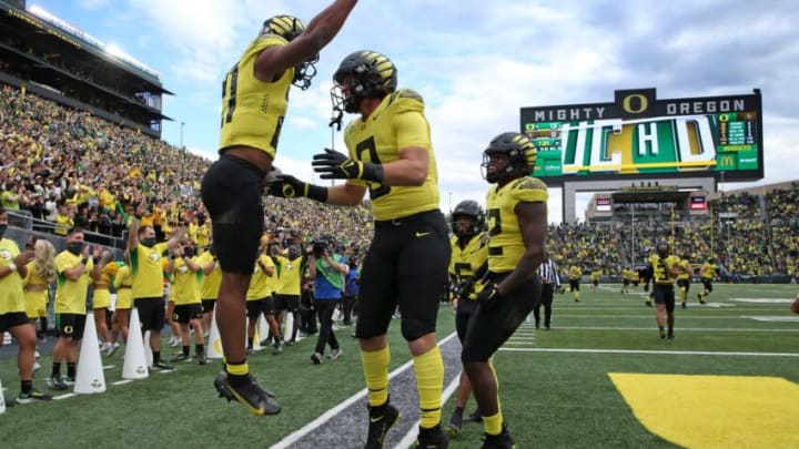 Oregon's Byron Cardwell, left, celebrates his touch down against Colorado during the first quarter Saturday Oct. 30, 2021.Eug 103021 Uo Cofb09
