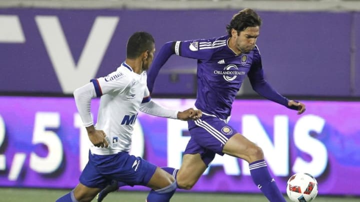 Feb 27, 2016; Orlando, FL, USA; Orlando City forward KaKa (right) battles Esporte Clube Bahia defender forward Luisinho (right) during the second half of a soccer match at the Florida Citrus Bowl. Orlando City won 6-1. Mandatory Credit: Reinhold Matay-USA TODAY Sports