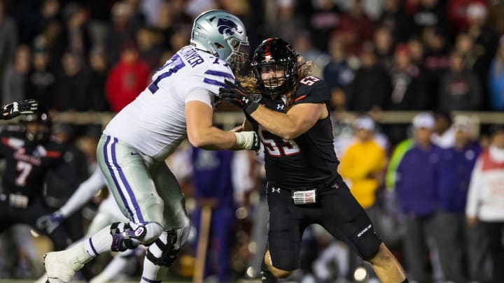 Defensive end Eli Howard #53 of the Texas Tech Red Raiders battles past right tackle Nick Kaltmayer #77 of the Kansas State Wildcats  (Photo by John E. Moore III/Getty Images)