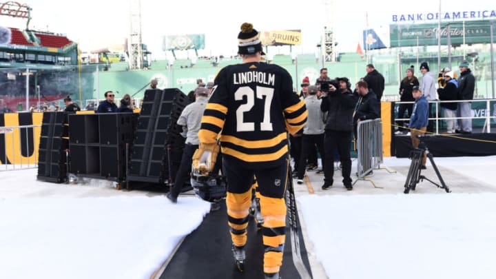 Jan 1, 2023; Boston, MA, USA; Boston Bruins defenseman Hampus Lindholm (27) walks to the ice during a practice day before the 2023 Winter Classic ice hockey game at Fenway Park. Mandatory Credit: Bob DeChiara-USA TODAY Sports