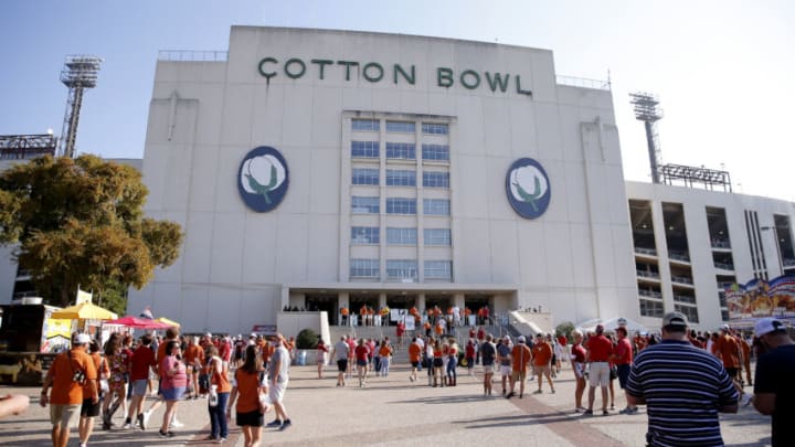 Oct 10, 2020; Dallas, Texas, USA; Fans walk outside Cotton Bowl Stadium before the Red River Showdown college football game between the Oklahoma Sooners (OU) and the Texas Longhorns (UT) at Cotton Bowl Stadium in Dallas, Saturday, Oct. 10, 2020. Mandatory Credit: Bryan Terry-USA TODAY NETWORK
