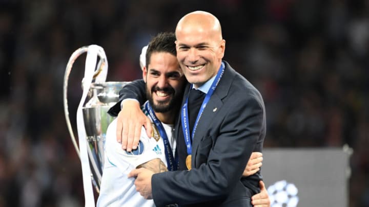 26 May 2018, Ukraine, Kiev: Soccer, Champions League final, Real Madrid vs FC Liverpool at the Olimpiyskiy National Sports Complex. Real's manager Zinedine Zidane (r) and player Isco embrace. Photo: Ina Fassbender/dpa (Photo by Ina Fassbender/picture alliance via Getty Images)