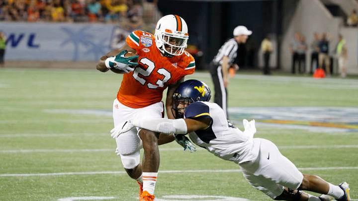 ORLANDO, FL - DECEMBER 28: Chris Herndon IV #23 of the Miami Hurricanes gets tackled after a reception against the West Virginia Mountaineers in the second half of the Russell Athletic Bowl at Camping World Stadium on December 28, 2016 in Orlando, Florida. Miami defeated West Virginia 31-14. (Photo by Joe Robbins/Getty Images) ORLANDO, FL - DECEMBER 28: Chris Herndon IV #23 of the Miami Hurricanes gets tackled after a reception against the West Virginia Mountaineers in the second half of the Russell Athletic Bowl at Camping World Stadium on December 28, 2016 in Orlando, Florida. Miami defeated West Virginia 31-14. (Photo by Joe Robbins/Getty Images)