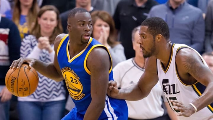 Nov 30, 2015; Salt Lake City, UT, USA; Utah Jazz forward Derrick Favors (15) defends against Golden State Warriors forward Draymond Green (23) during the second half at Vivint Smart Home Arena. The Warriors won 106-103. Mandatory Credit: Russ Isabella-USA TODAY Sports